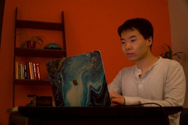 Ben Yu working on its laptop